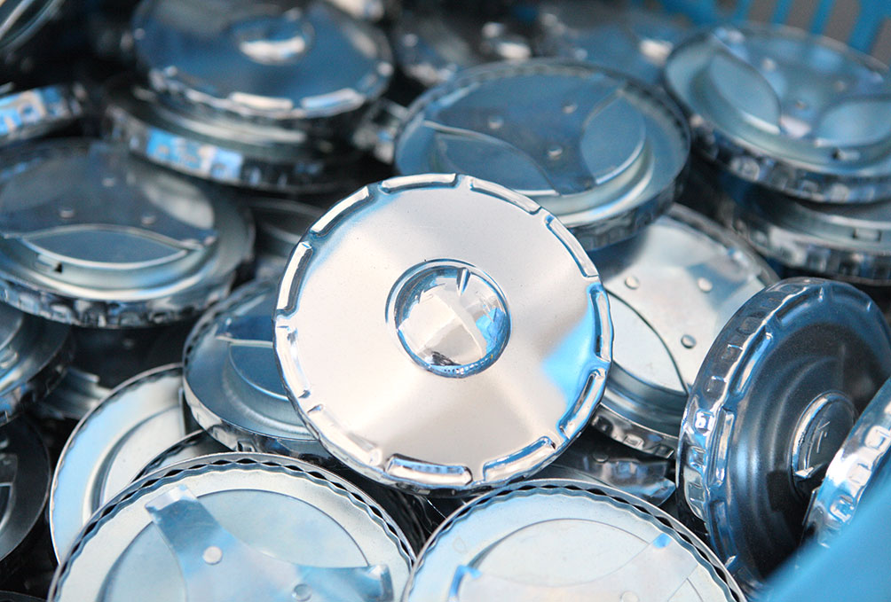 Stainless steel fuel cap faces before assembly
