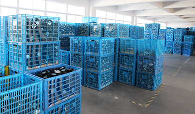 Finished parts warehouse in blue crates